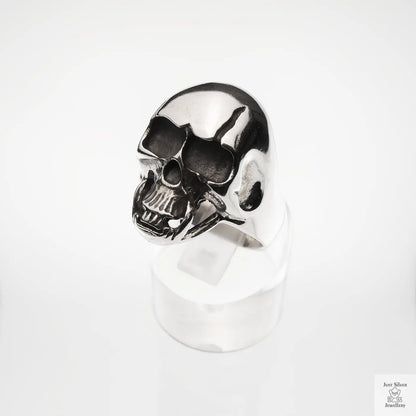 Silver skull ring on a white background