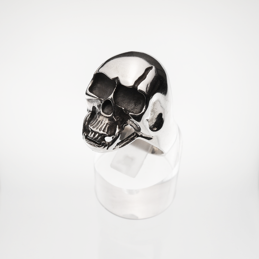 Silver skull ring on a white background