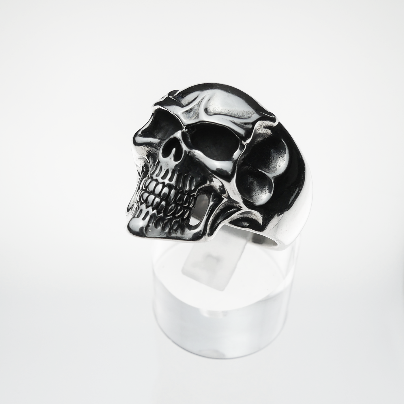 Silver skull ring on a white background