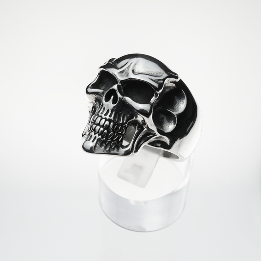 Silver skull ring on a white background