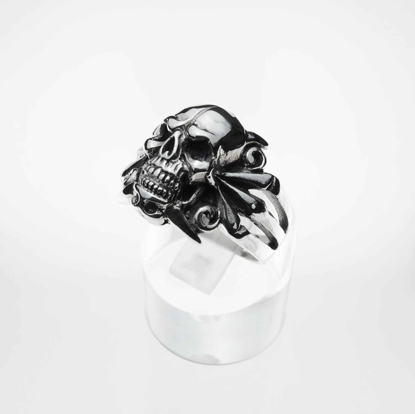 Skull-shaped ring on a white background