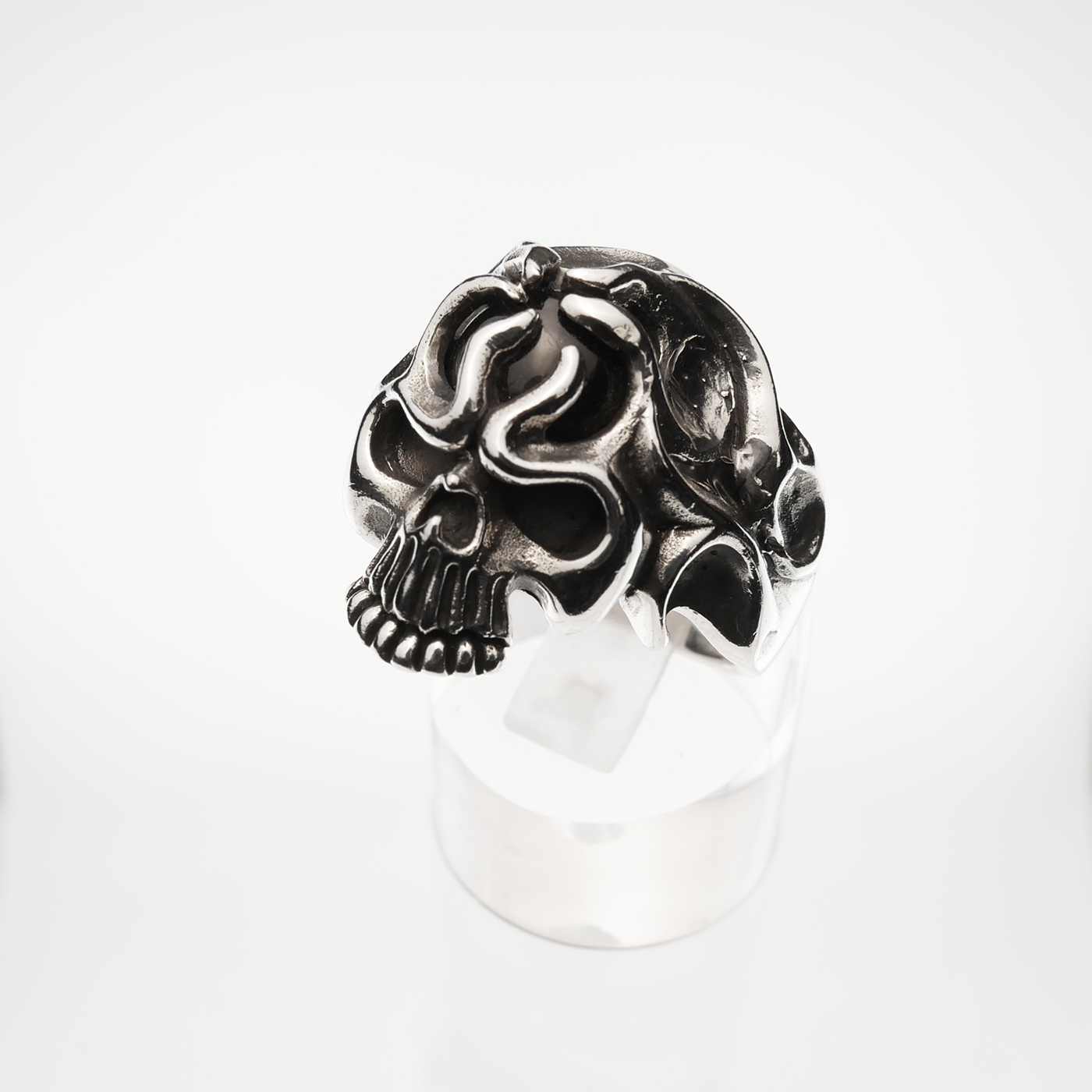 Silver skull ring on a white background