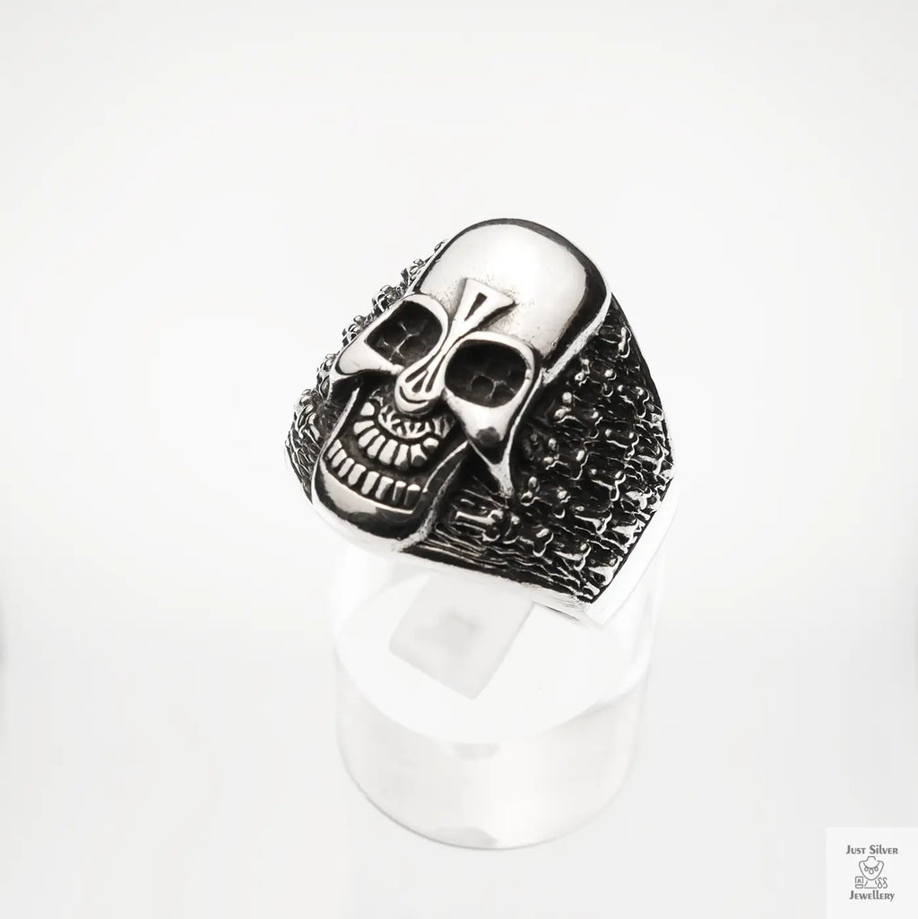 Silver skull ring on a white background