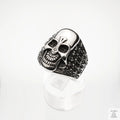 Silver skull ring on a white background