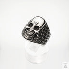 Silver skull ring on a white background