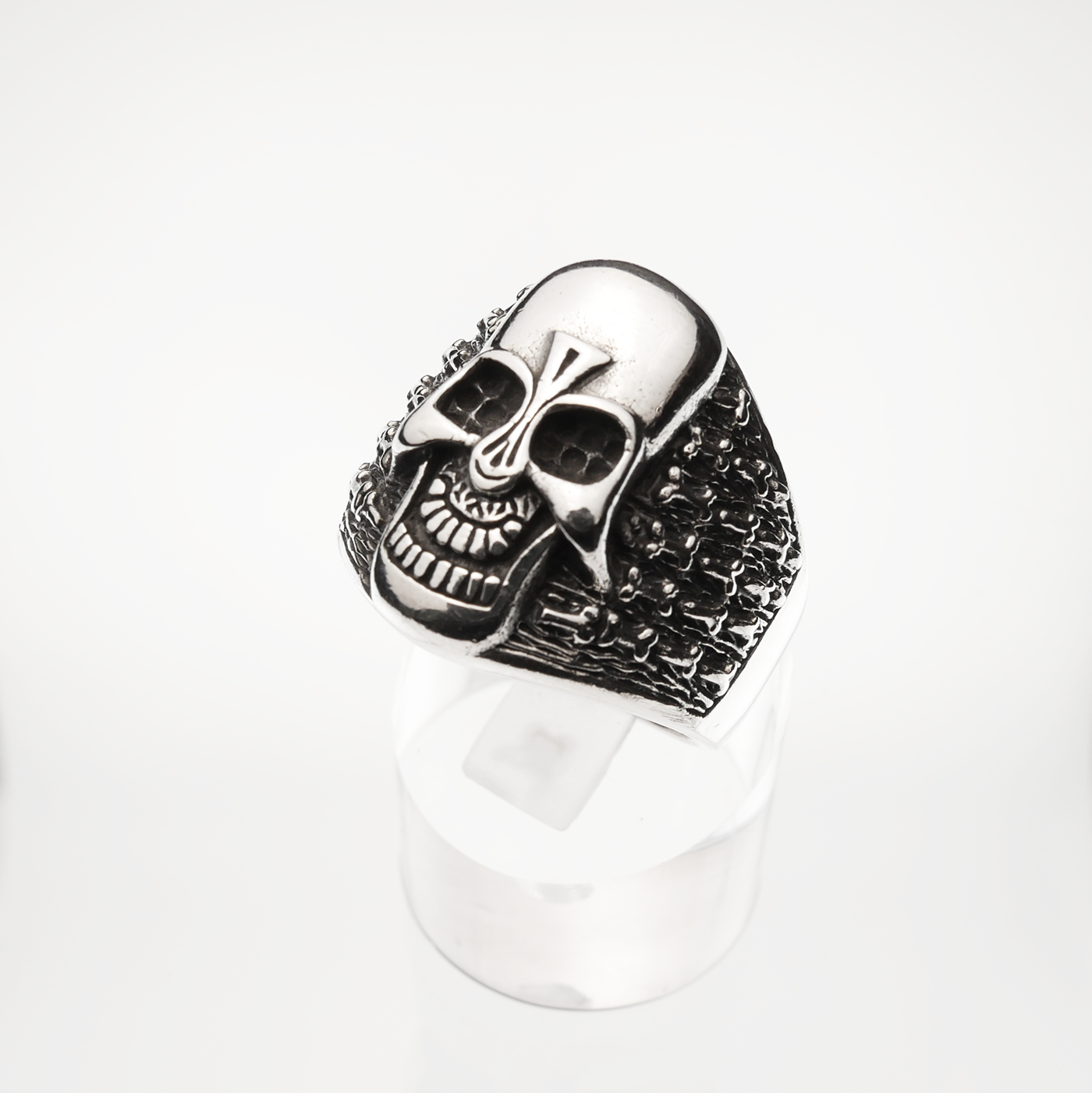 Silver skull ring on a white background