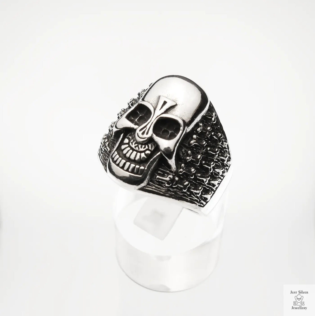Silver skull ring on a white background