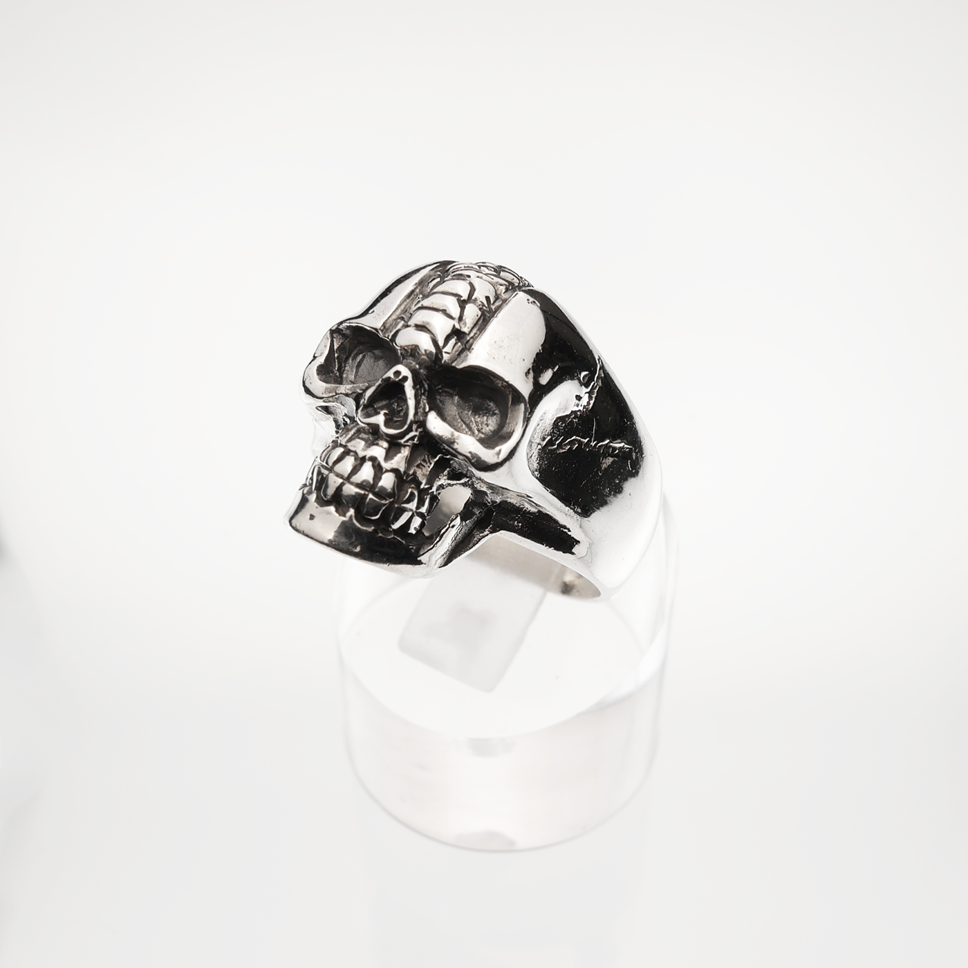 Silver skull ring on a white background