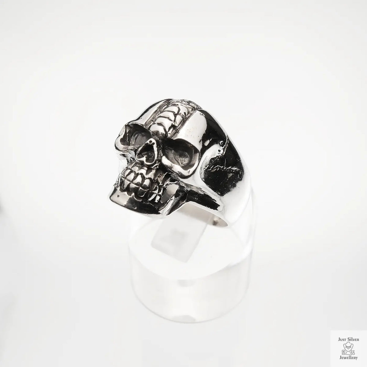 Silver skull ring on a white background