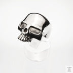 Silver skull ring on a white background