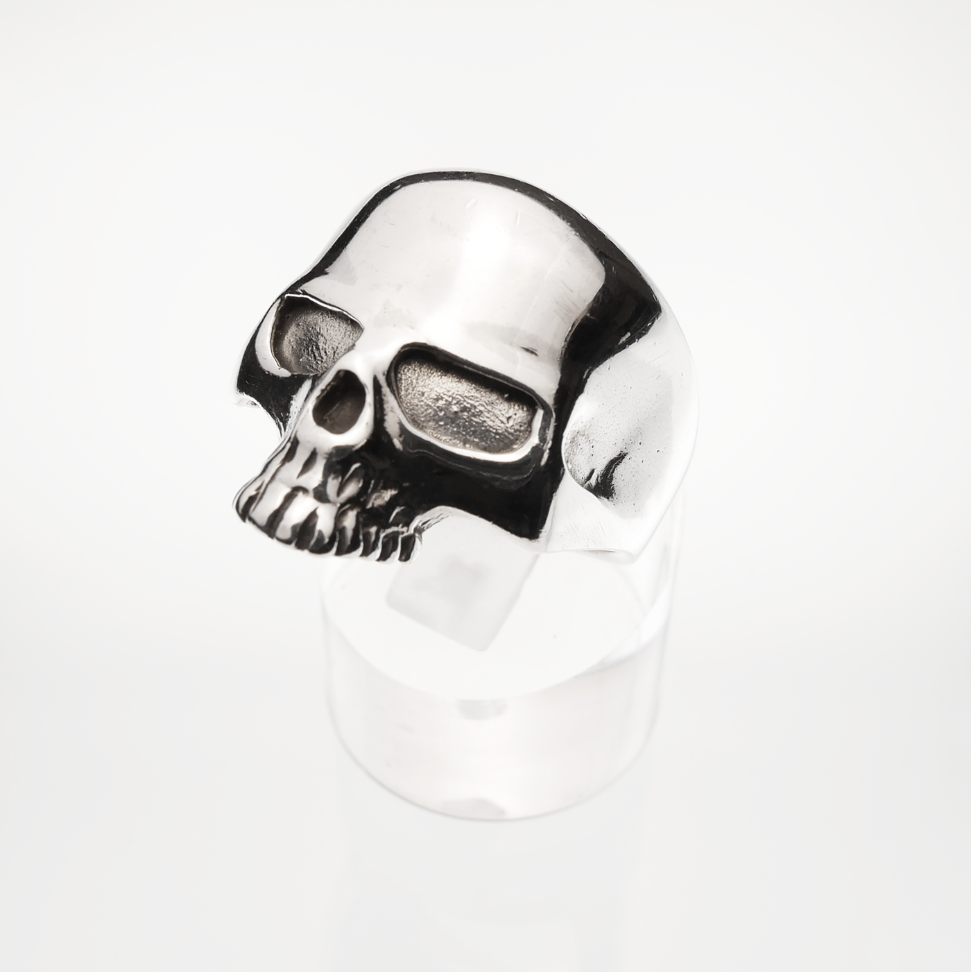 Silver skull ring on a white background
