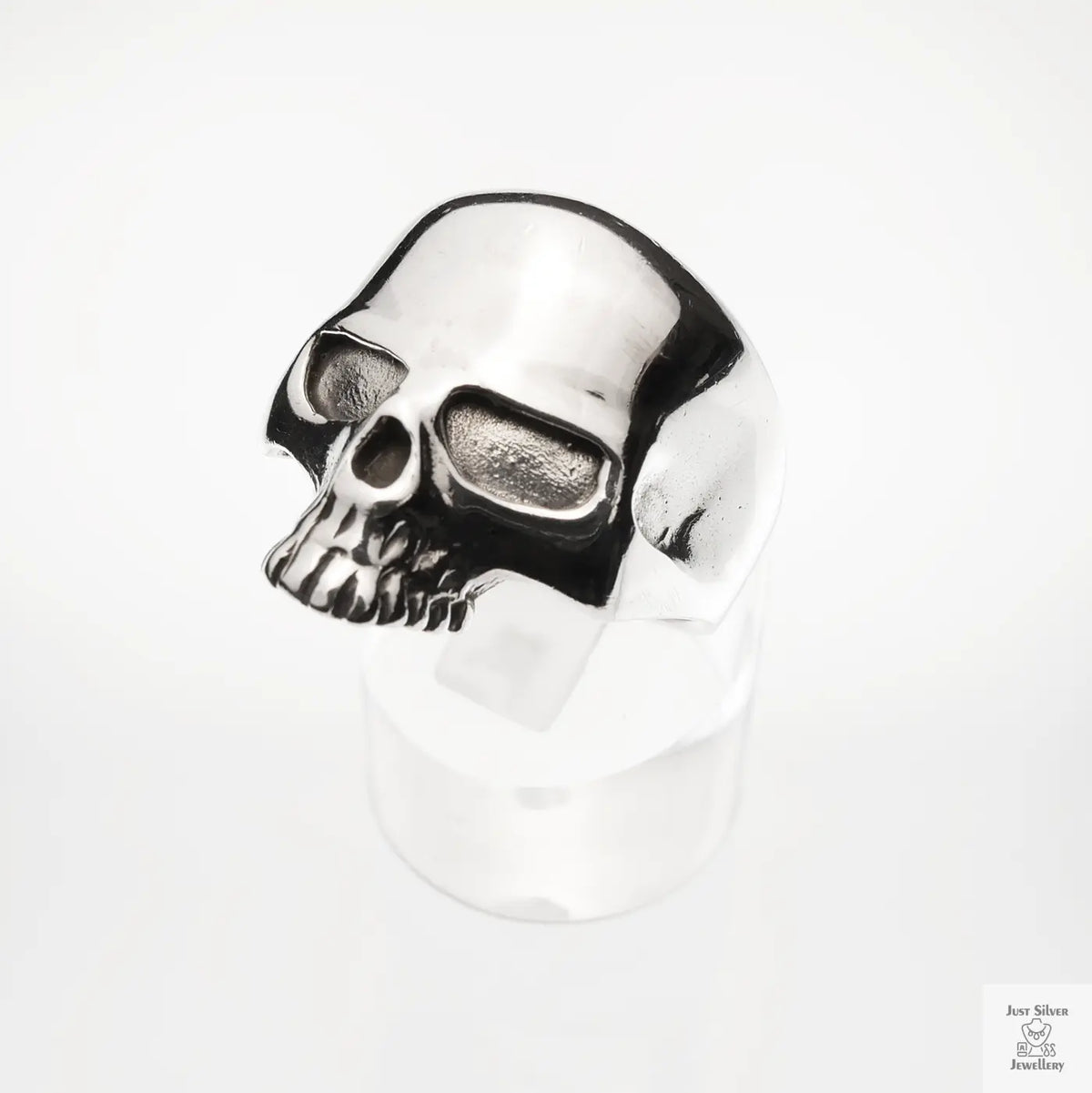 Silver skull ring on a white background