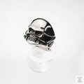 Silver skull ring on a white background