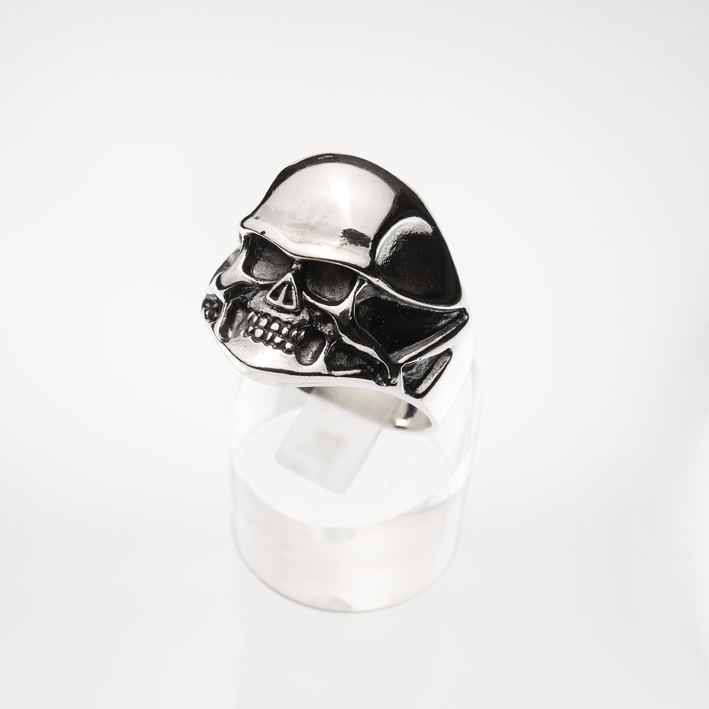 Silver skull ring on a white background