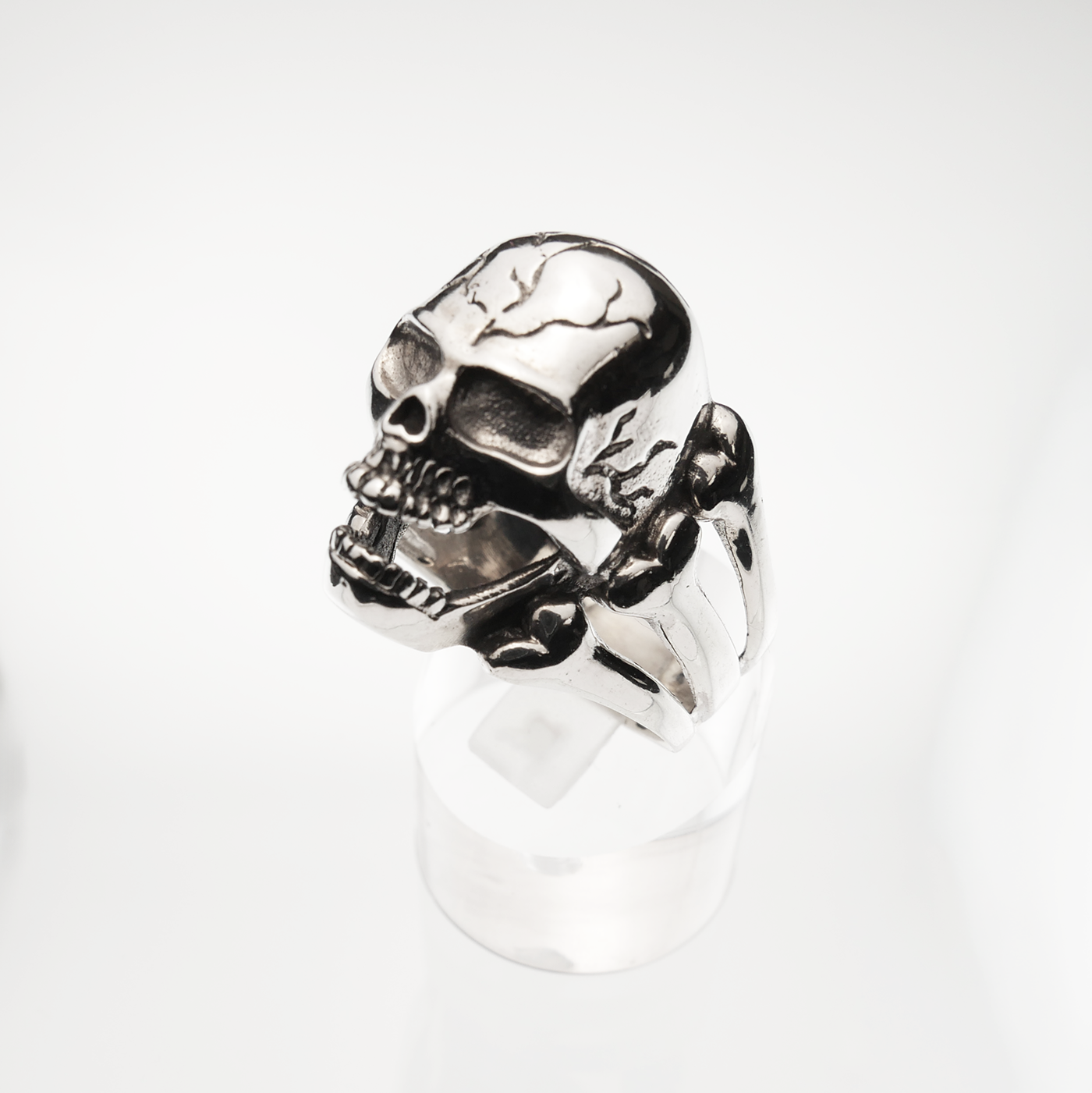 Silver skull ring on a white background