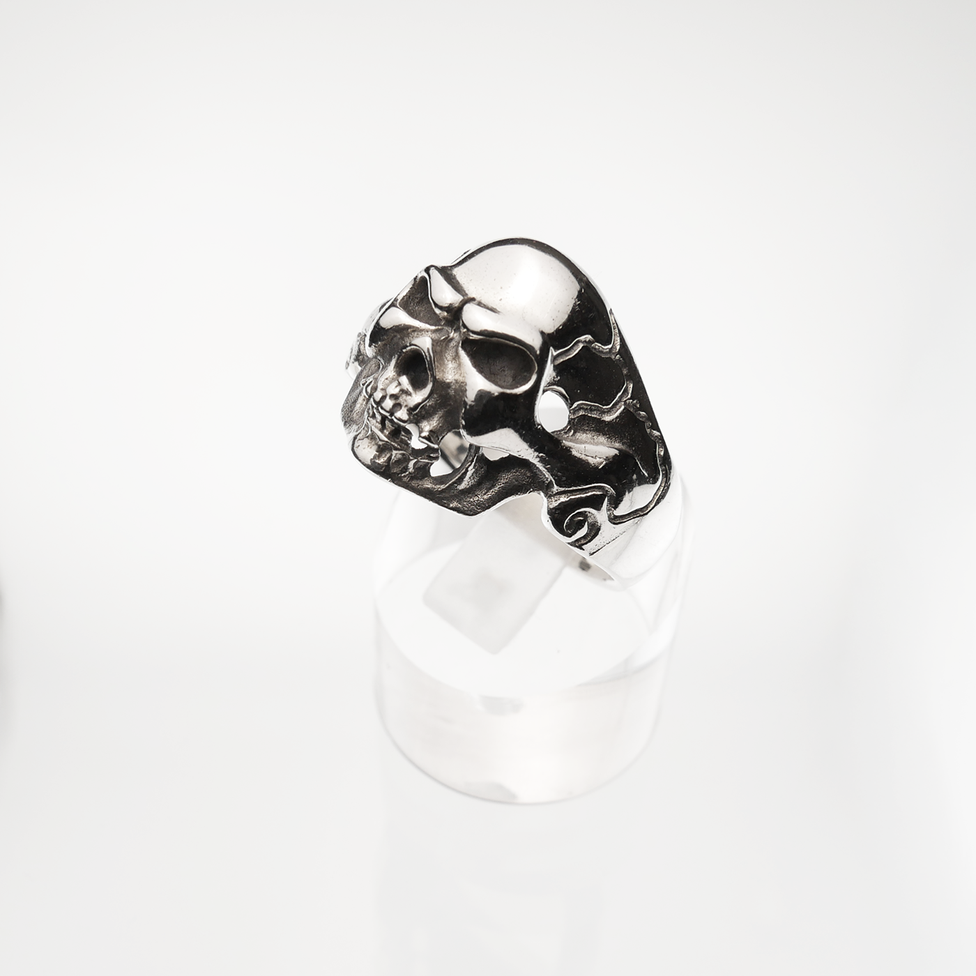 Silver skull ring on a white background