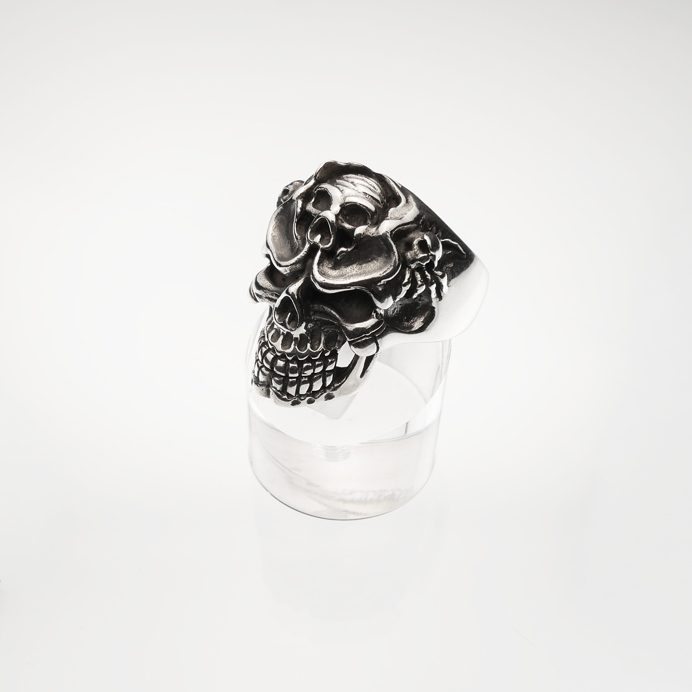 Silver skull ring on a white background