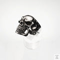 Silver skull ring on a white background