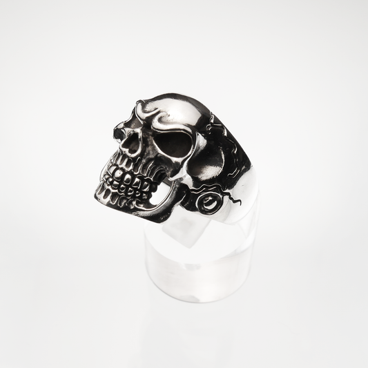 Silver skull ring on a white background