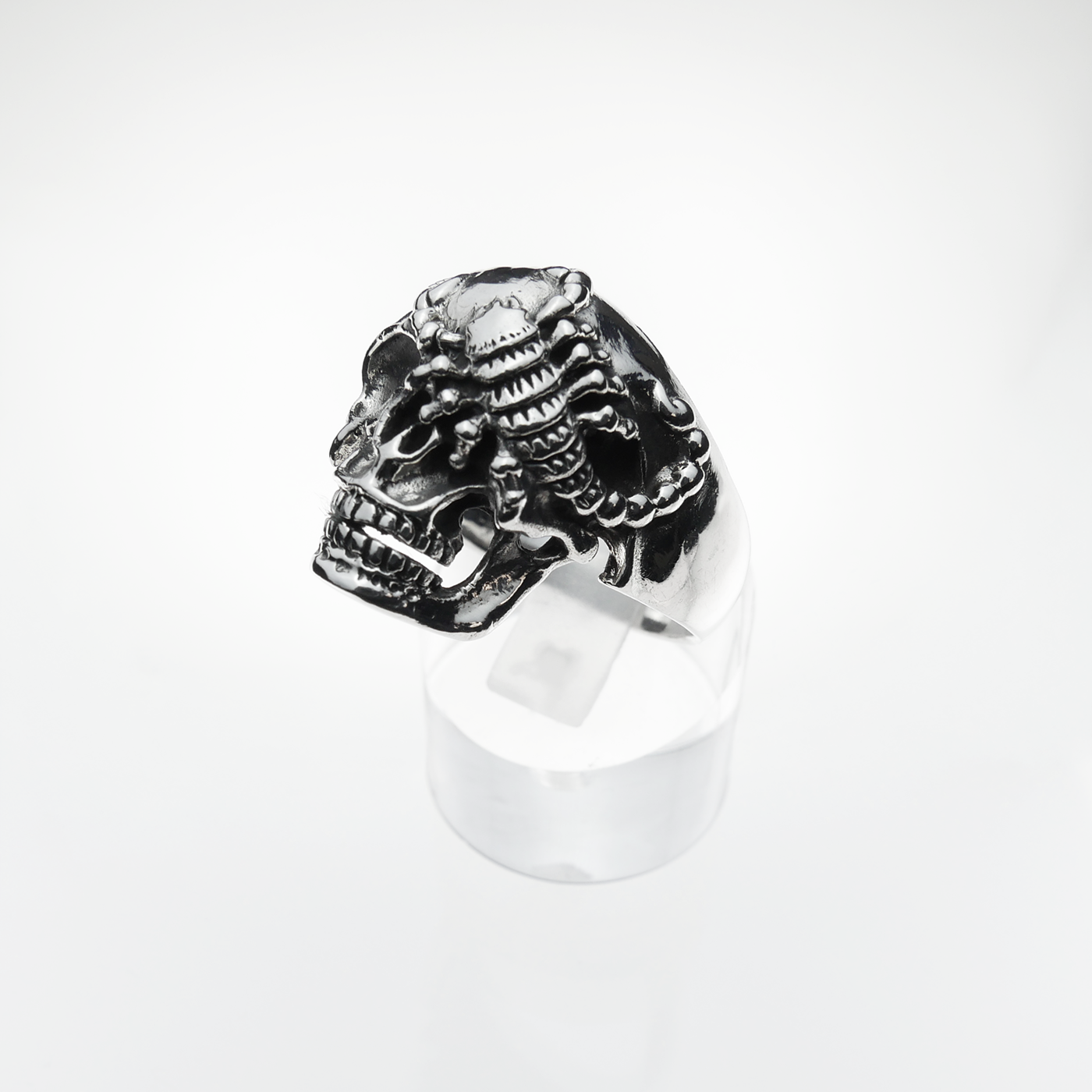 Silver skull ring on a white background