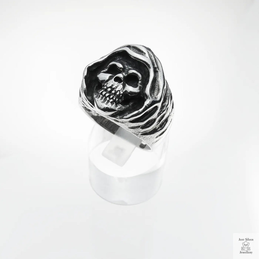 Silver skull ring on a white background