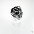 Silver skull ring on a white background