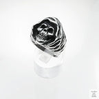 Silver skull ring on a white background