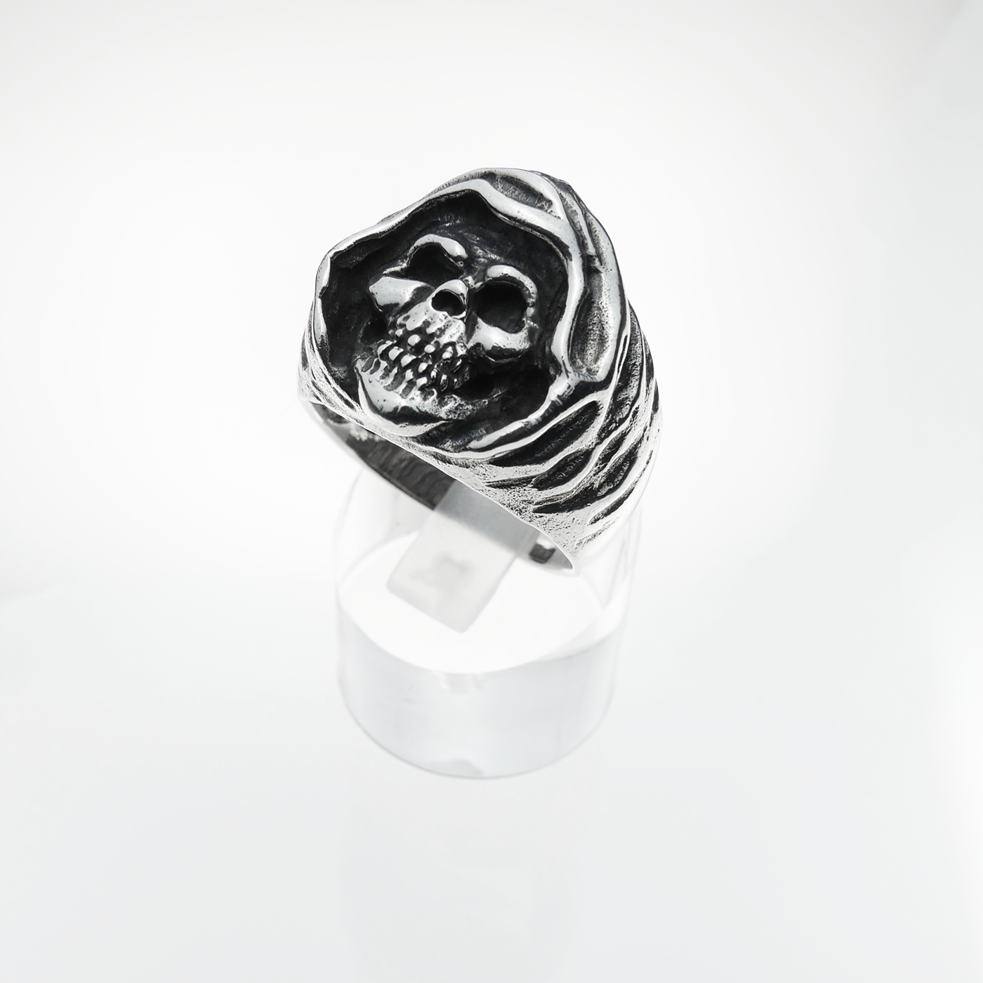 Silver skull ring on a white background