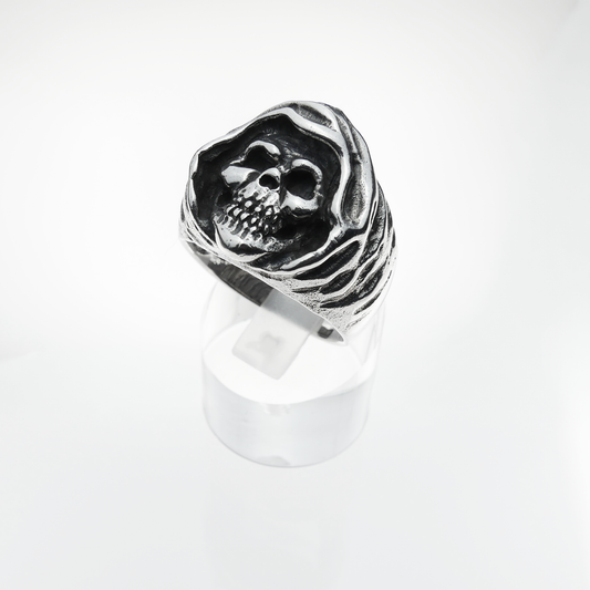 Silver skull ring on a white background