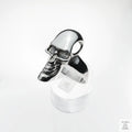 Silver skull ring on a white background