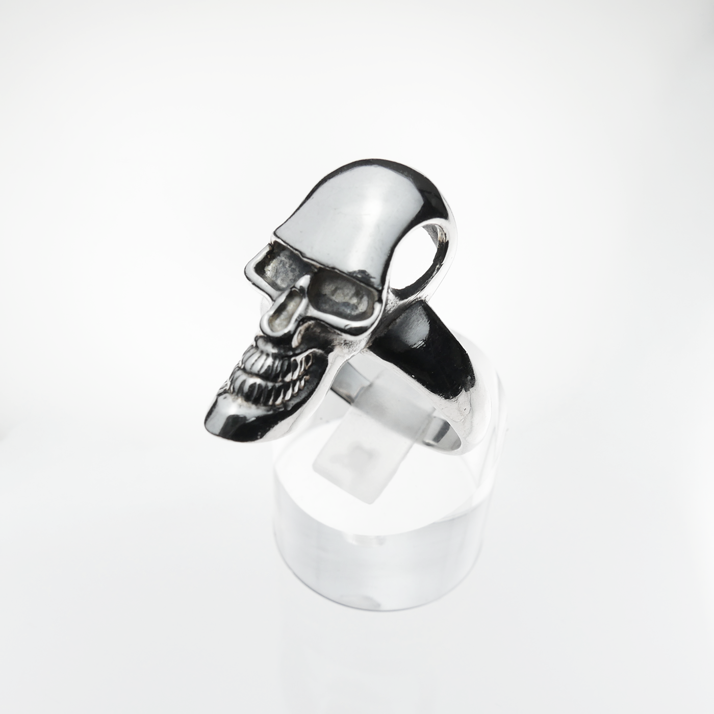 Silver skull ring on a white background