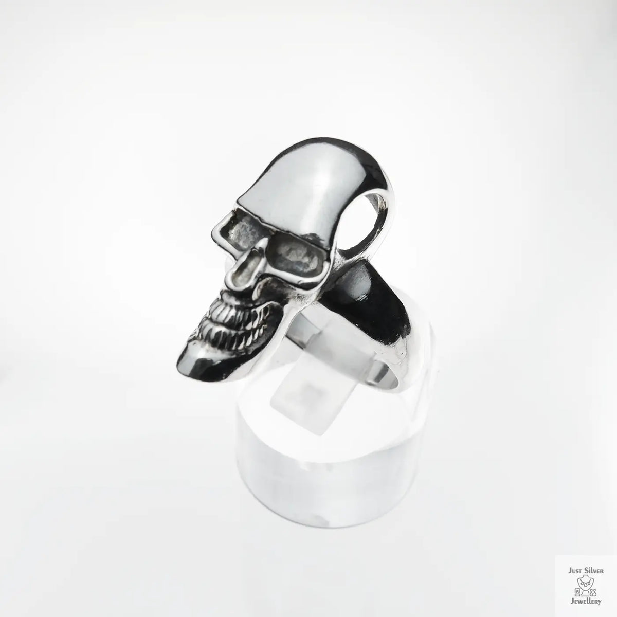 Silver skull ring on a white background