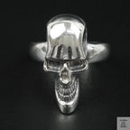 Silver skull ring on a black background