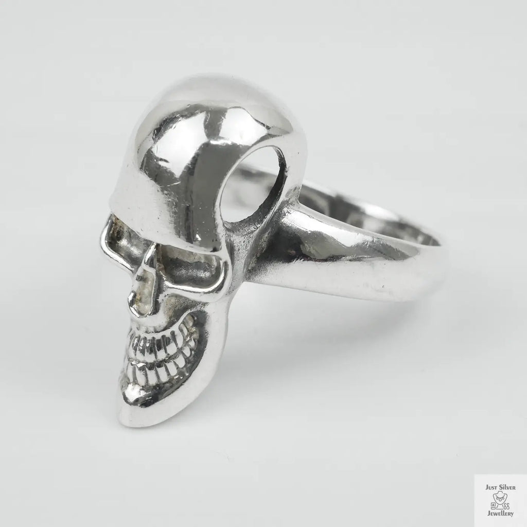 Silver skull ring on a white background