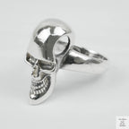 Silver skull ring on a white background