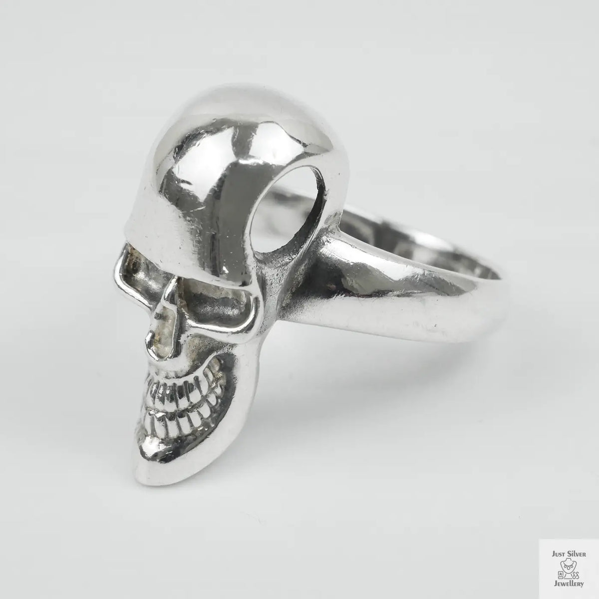 Silver skull ring on a white background