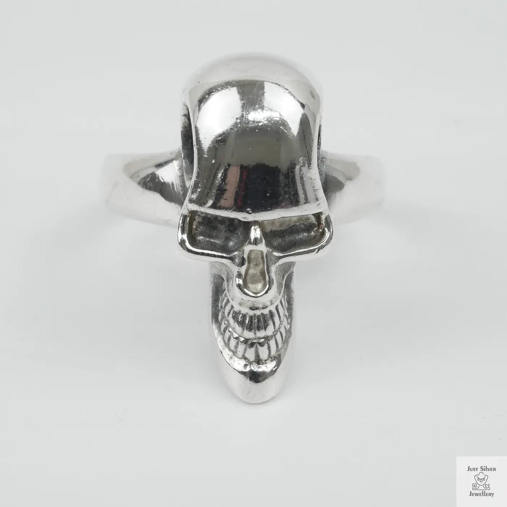 Silver skull ring on a white background