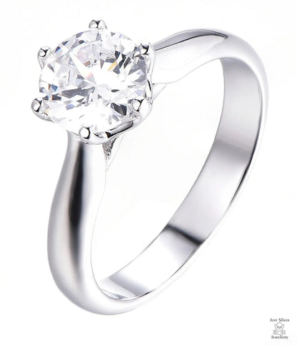 Silver ring with a large zircon on a white background