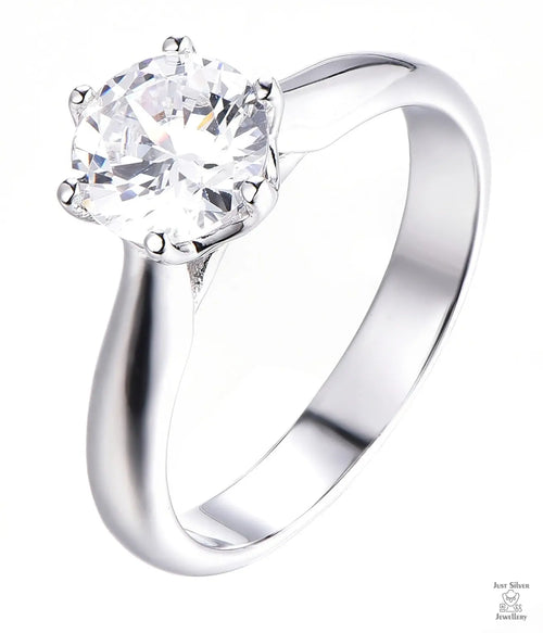 Silver ring with a large zircon on a white background