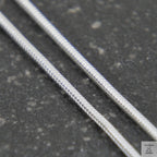 Thin metal rod on a white background