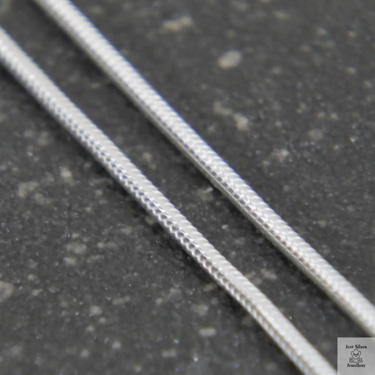 Thin metal rod on a white background