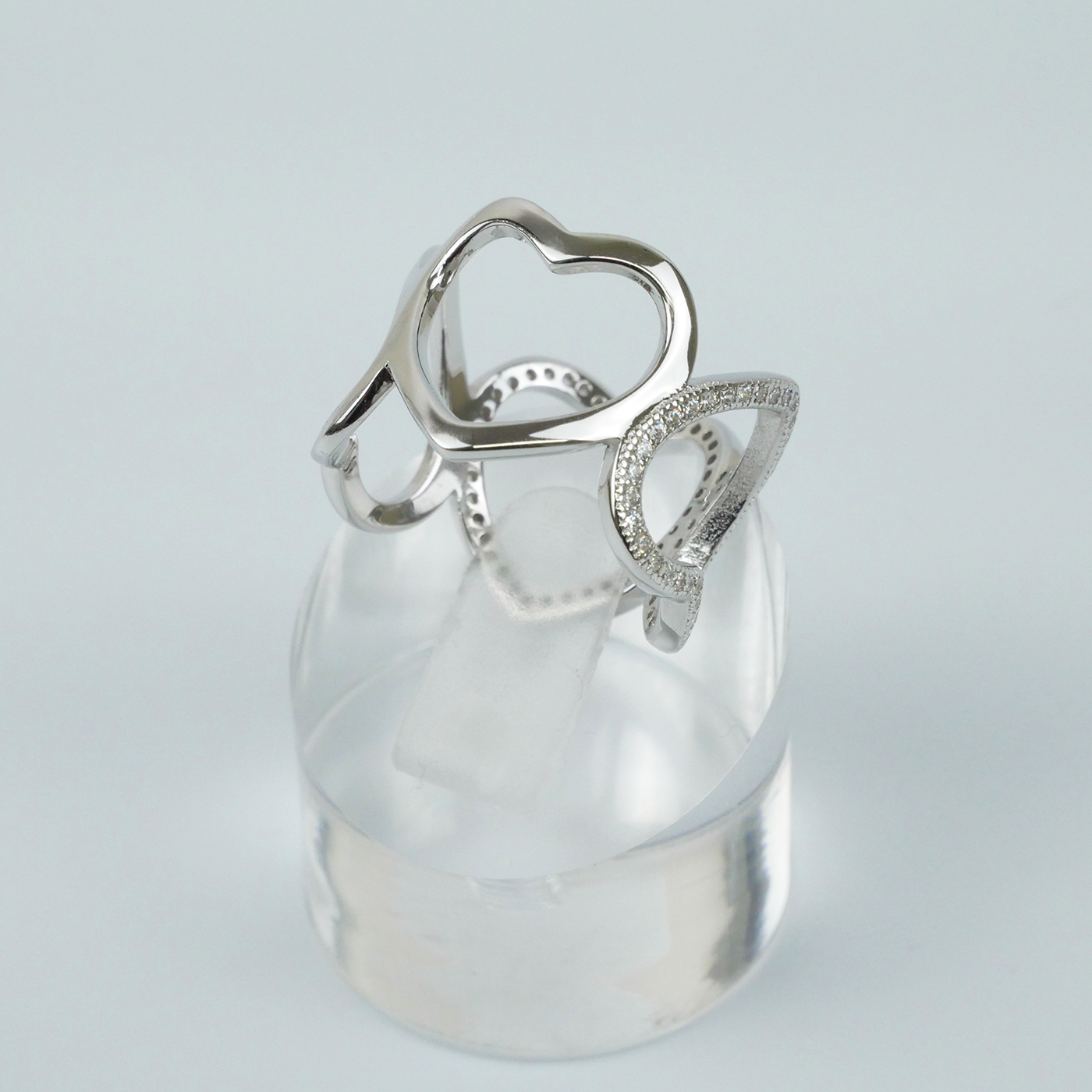 Silver ring with a unique design on a light gray background