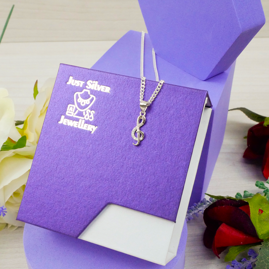 "Treble Clef" pendant with white Zirconia gems