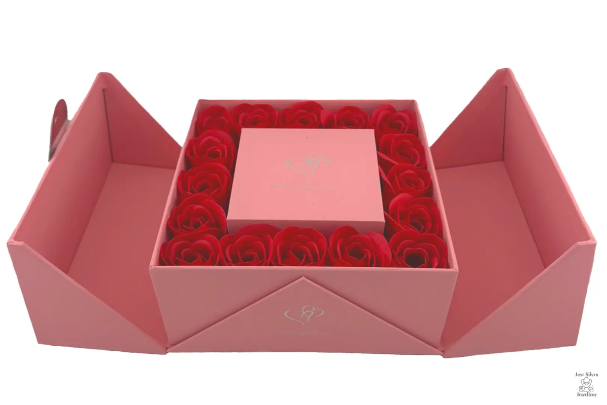 A red Eternity Double Door Rose Gift Box with a flip-top opening, containing a bed of red roses.