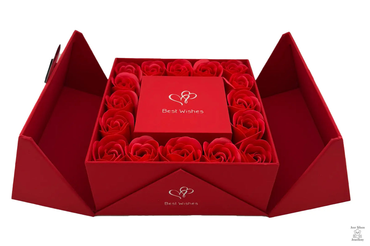 A red Eternity Double Door Rose Gift Box with a flip-top opening, containing a bed of red roses.
