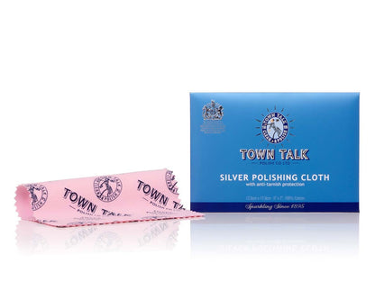 A blue box of Town Talk Silver Polishing Cloth with a pink cloth partially unwrapped and showing the brand and product name.